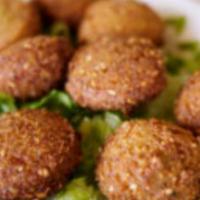 Veggie Combo Choice of 3 · Humos, Babagnoush, Med Dip, Tabuleh, Falafel
, Grape leaves - 