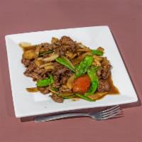 Mongolian Beef · Sliced beef with pea pods, mushrooms, water chestnuts, bamboo shoots, and onions. Served wit...