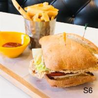Crispy Chicken Sandwich · Well marinated crispy chicken, lettuce and tomatoes. Served with french fries.