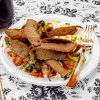 SL2. Steak & lamb Salad · Slices of marinated lamb over Greek salad.