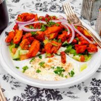 SL3. Chicken Salad · Slices of marinated chicken over Greek salad.