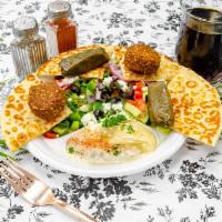 P3. Veggie Plate · 2 falafels, 2 dolmas with a side of hummus and a side of baba ghanoui eggplant.