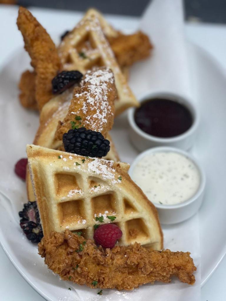 Chicken & Waffles · Sweet and salty crispy country-fried chicken breast tenders and a malted Belgian style waffle served with warm real maple syrup.