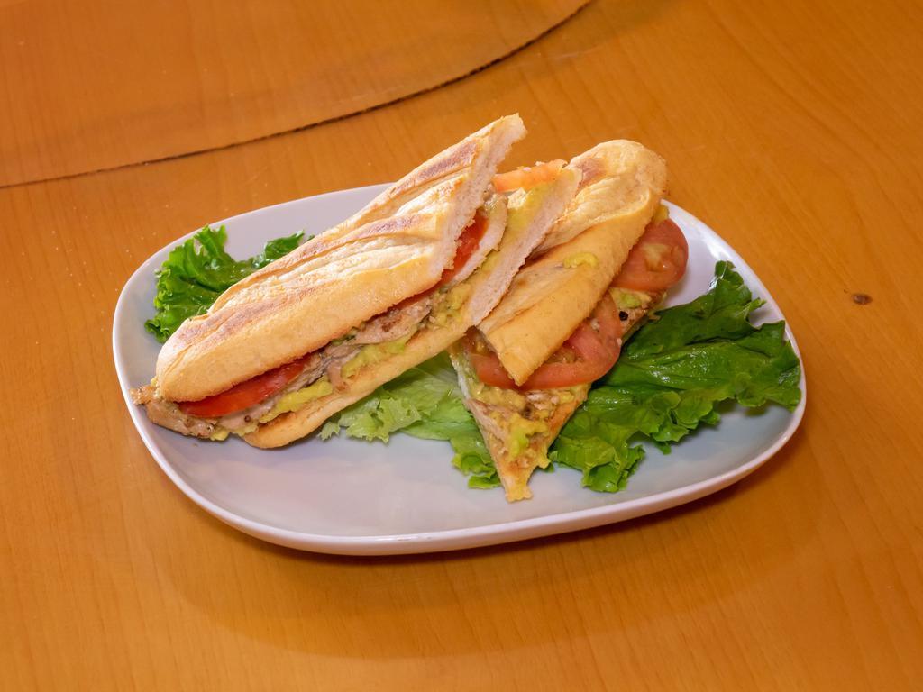 Ave Italiano Sandwich · Chicken breast, tomatoes, avocado and mayo on a baguette.