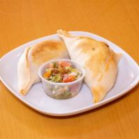 Homemade Baked Chicken Empanada · Comes with chicken and onion.