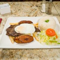 Bistec a lo Pobre · Grilled steak served with french fries, fried plantains, eggs, rice, and salad.