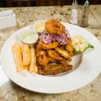 Jalea Mixta de Mariscos · Fried seafood marinated in special sauce and topped with bread flour served with fried yucca...