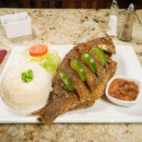 Mojarra Frita · Whole fried fish served with beans, rice and salad.