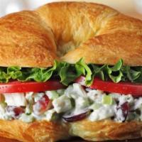 Chicken Salad Sandwich · Freshly made chicken salad with lettuce and tomato on a flaky croissant.