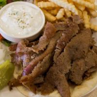 Gyro · 6 oz. of Gyros Meat, Tomatoes, Onions, Homemade Tzatziki Sauce Served on a pita.