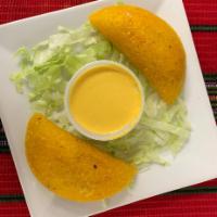 Empanadas · Fried flour tortilla w/ your choice of chicken or beef, 