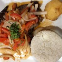 Bistec Encebollado  · Grilled pepper steak topped with sauteed tomatos, onions and cilantro served with fried  pot...