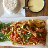 Pollo Saltado · Strips of chicken sauteed with tomatoes, onions, and green peppers. served over fries with w...