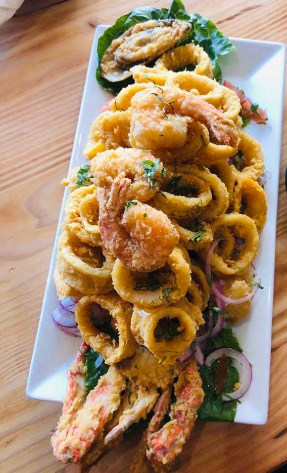 Jalea · Mixed fried seafood platter with fresh basa fillet, clams, mussels, shrimp, calamari and fried yucca topped with salsa criolla.