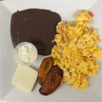 El chapin. · Scrambled eggs mix w/ tomatoes and onions, served w/ refried black beans, sweet plantain, so...