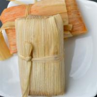 Huminta / Gluten Free & Vegetarian  · Andean Corn, Spicy Peppers, Cheese & Singani wrapped in Corn Husks and Steamed 
