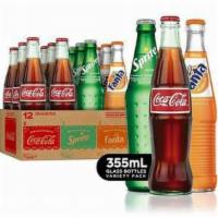 Mexican Sodas · Choose your favorite bottle of Mexican Soda. Made with real sugar. Comes in a 355 ml glass b...