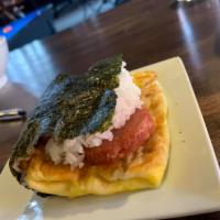 Spam Musubi Wrap · Egg, kimchi, rice, and a slice of spam blanketed in a seaweed wrap.