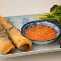 Handmade Crispy Rolls · Ground Pork, Jicama, Woodear Mushrooms, Mung Bean. 2 rolls served with Lettuce & Mint for wr...