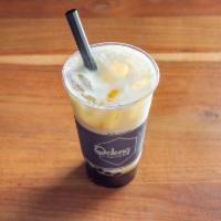Oolong Milk Tea · Freshly brewed Oolong Tea made with a splash of whole milk and natural cane sugar. 