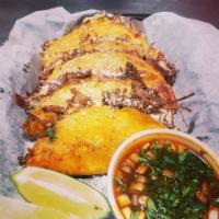 Birria Tacos · Folded tortilla with a variety of fillings such as meat or beans. 