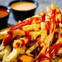 Sauced up Fries  (100% plant-based) · Fries covered with a mix of our famous Sauces.