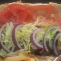 Tri Tip Sandwich  · Thinly sliced BBQ Tri Tip with Lettuce-Red Onion-Tomatoes served on a French Roll.