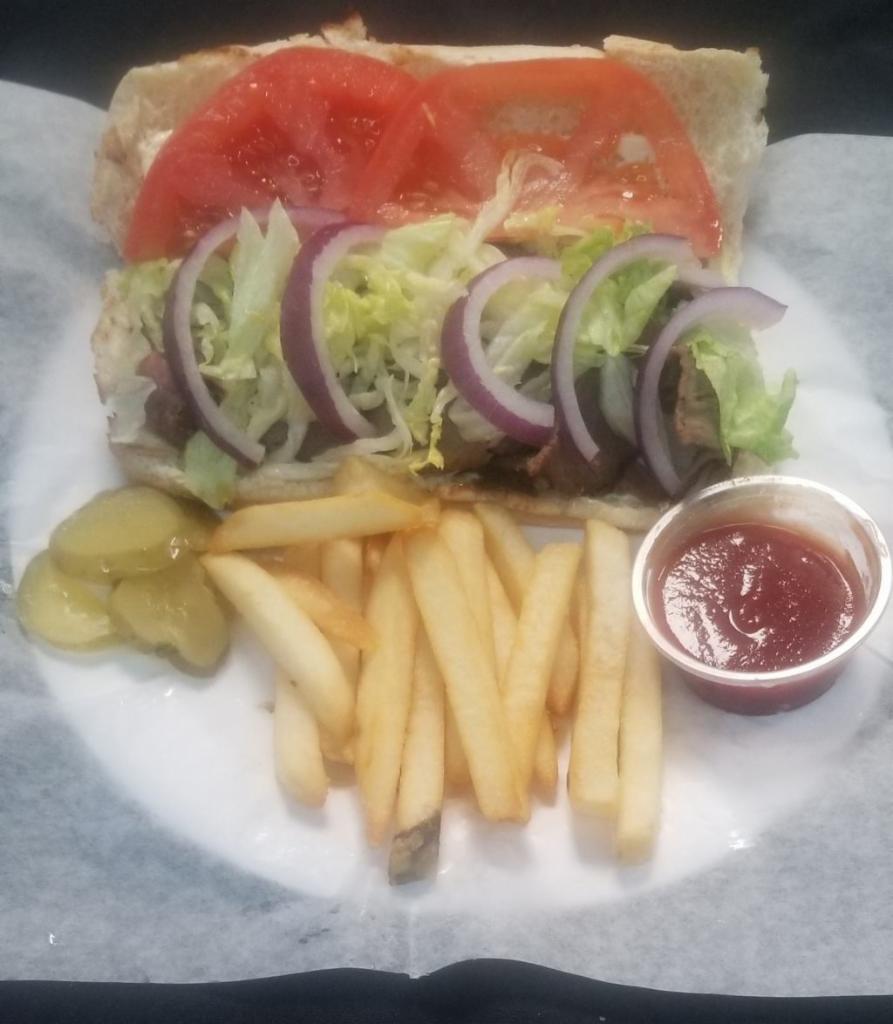 Tri Tip Sandwich  Combo · Thinly sliced BBQ Tri Tip with Lettuce-Red Onion-Tomatoes served on a French Roll with Fries.