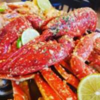 Super Seafood Combo · Shrimp, lobster, snow crab legs, mussels, crawfish with potatoes, and corn.