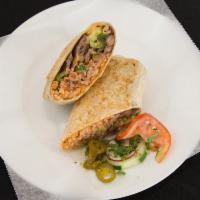 Burrito · Soft flour tortilla with rice, beans, onions, cilantro, and any meat.