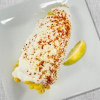 CRAZY CORN · corn on the cob, melted butter, cotija cheese, crema, tajin, lime wedge