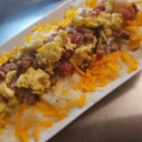 Breakfast Bowl · Eggs, bacon or sausage and cheddar cheese served over creamy grits!!