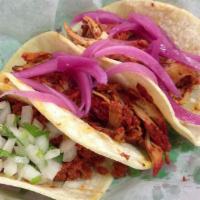 Al Pastor Taco · Jacalitos seasoned pork with guajillo and pineapple. Order of 3 tacos with onion and cilantr...