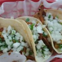 Chorizo Taco · Mexican sausage. Order of 3 tacos with onion and cilantro on the top.