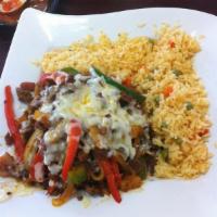Alambre · Sauteed beef, Mexican sausage, bacon, with green-red pepper, onion, and pineapple, all cover...
