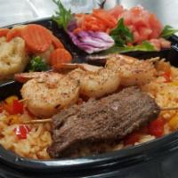 Two Steaks and Shrimps Skewers · Seared steaks and Shrimps include Spanish rice 