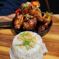 Adobo Chicken Wings · Garlic rice, chicken wings, hard-boiled egg, traditional Filipino adobo sauce, and cilantro.
