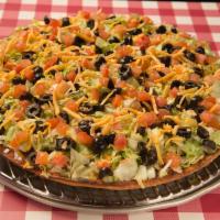 25. Taco Pizza · Seasoned ground beef topped with cheddar cheese, black olives, tomatoes, lettuce and green c...