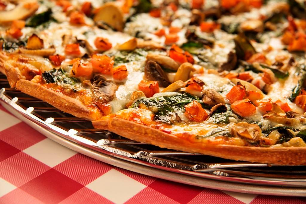 27. Tomato, Spinach and Mushroom Pizza · Diced tomatoes, marinated fresh spinach with spices and mushrooms.