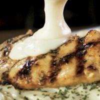 Chicken Alfredo Pasta · Grilled boneless breast of chicken covered with a rich, creamy, cheese sauce. Served over sp...