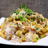 Kamikaze Fries · Signature crab mix, avocado and mango salsa on a bed of fries. Topped with spicy mayo, eel s...