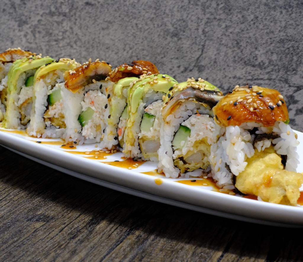 Dragon Roll · Shrimp tempura, crab mix and cucumber topped with unagi, avocado and eel sauce.