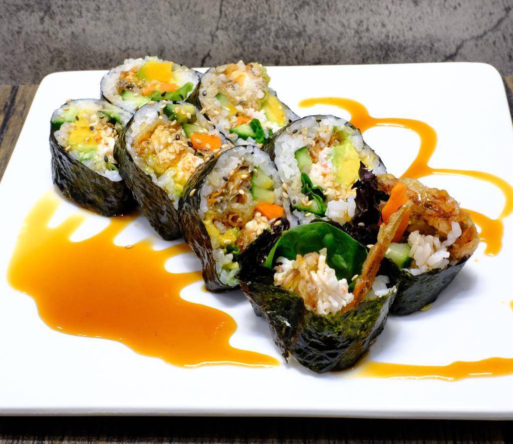 Spider Roll · Crab mix, lettuce, cucumber, avocado, softshell crab, pickled carrots topped with eel sauce.