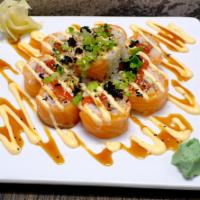Orange Blossom Roll · Spicy tuna, avocado, cucumber, topped with salmon, tobiko, chives, spicy mayo, sriracha and ...