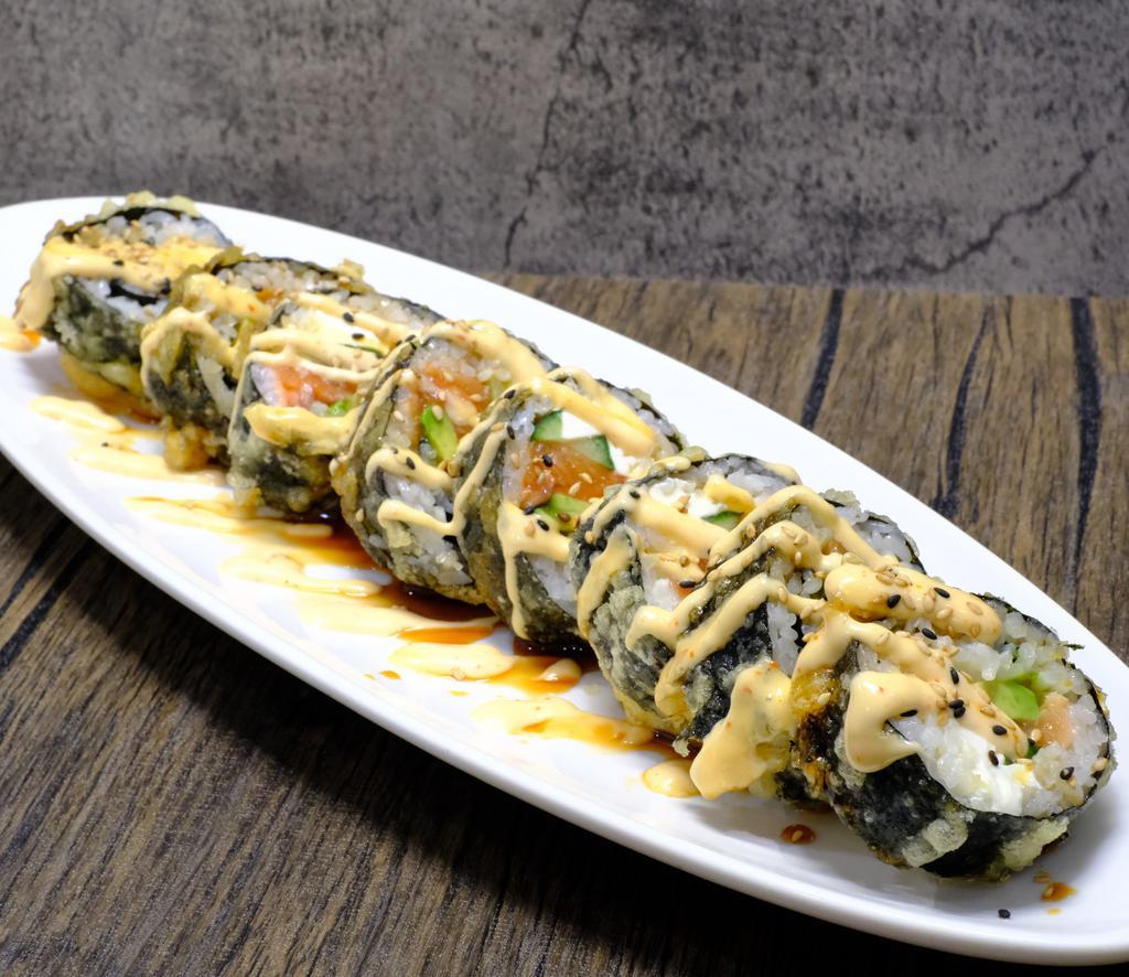 Yummy Roll · Deep fried. Salmon, crab mix, cream cheese, cucumber and avocado topped with spicy mayo and eel sauce.