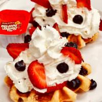 Belgian Sugar Pearl Waffles  · Served with fresh berries and whipped cream.