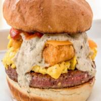 The Hangover Burger · Impossible burger patty, Just egg, tater tots, violife cheddar cheese, vegan impossible saus...