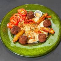 Falafel Plate · Small chef salad, falafel balls, hummus, tahini fries. Vegan.