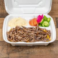 Beef Shawarma with Rice · Beef Shawarma Rice, hummus and salad and tahini.