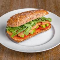 Smoke Salmon Sandwich · Salmon, avocado, cream cheese, arugula, tomato and olive oil on multigrain ciabatta.
